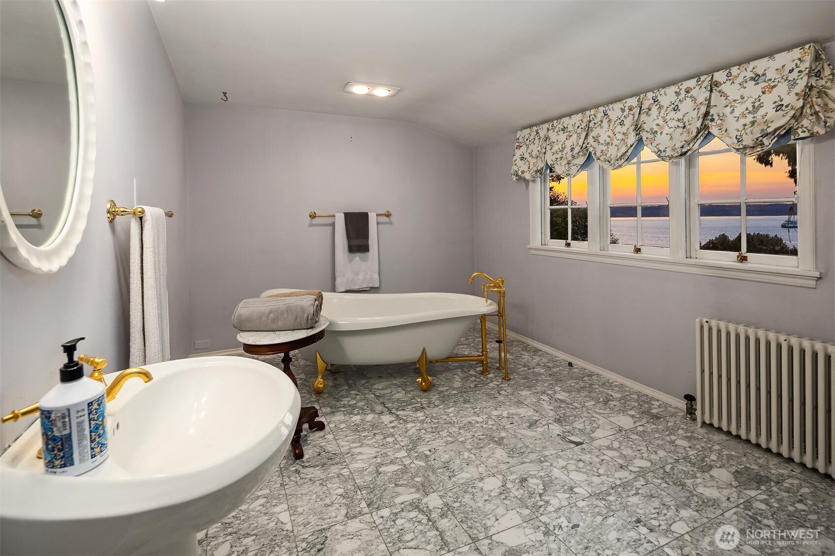 3727 Shore Avenue Everett, WA 98203 - Photo 37 of 40 a bathroom with a sink and a mirror