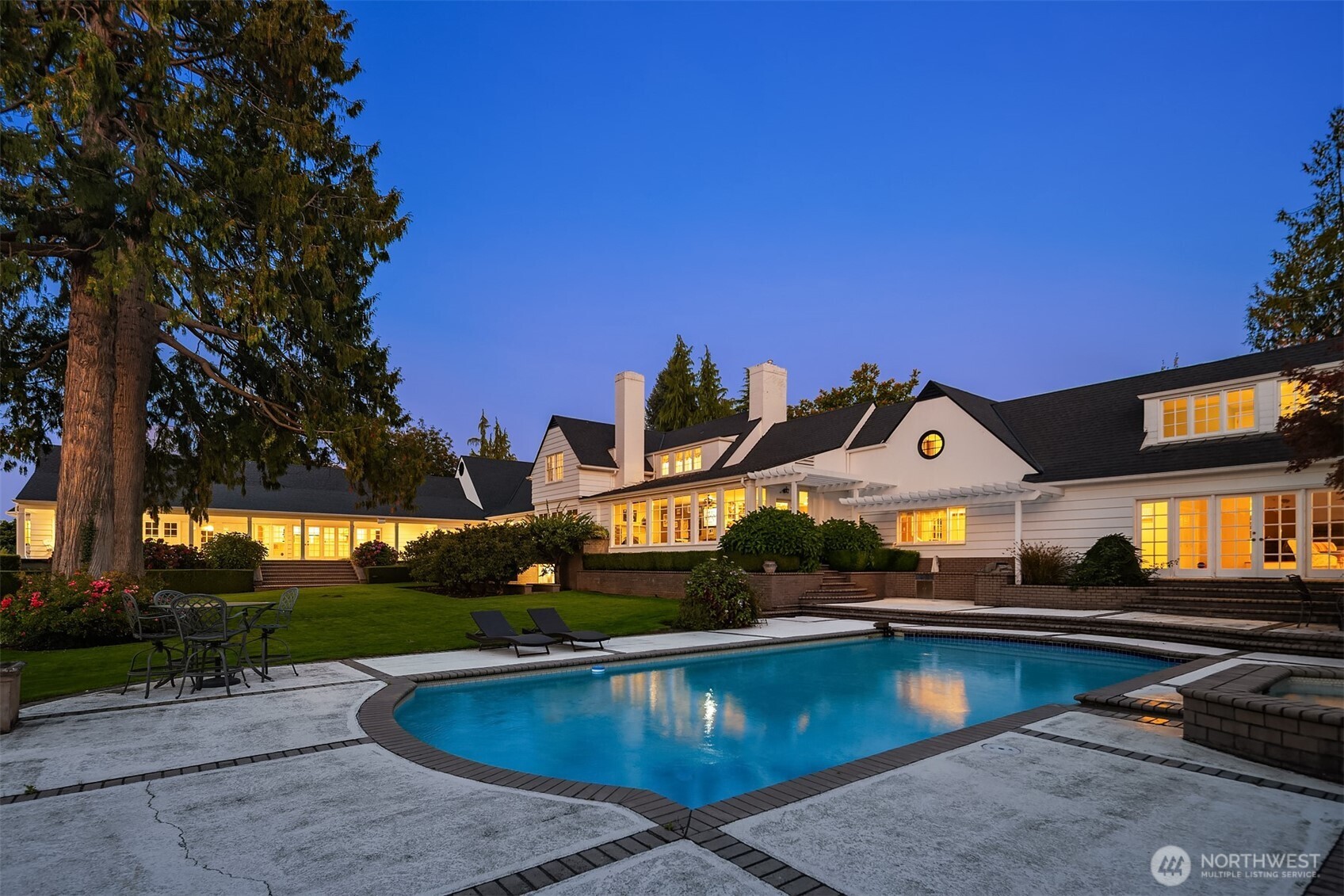 3727 Shore Avenue Everett, WA 98203 - Photo 8 of 40 a view of a swimming pool with lawn chairs and plants