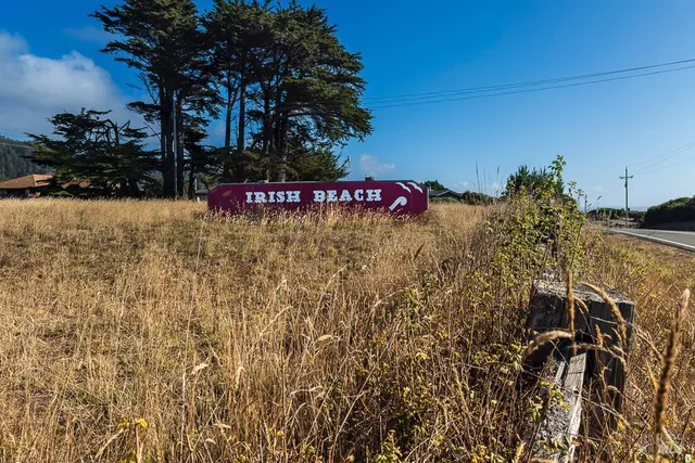 a street sign is next to a building