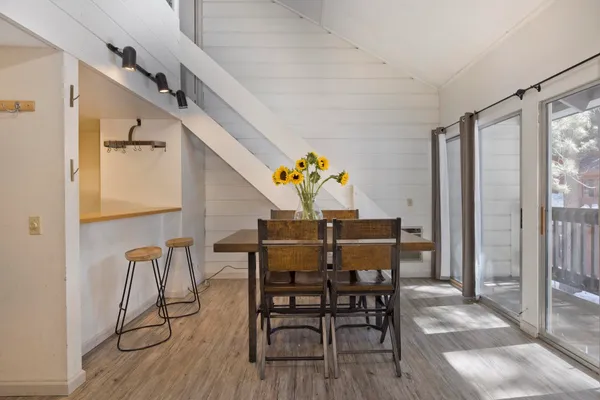 a view of a dining room with furniture window and outside view