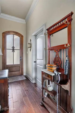 a view of room with window and wooden floor