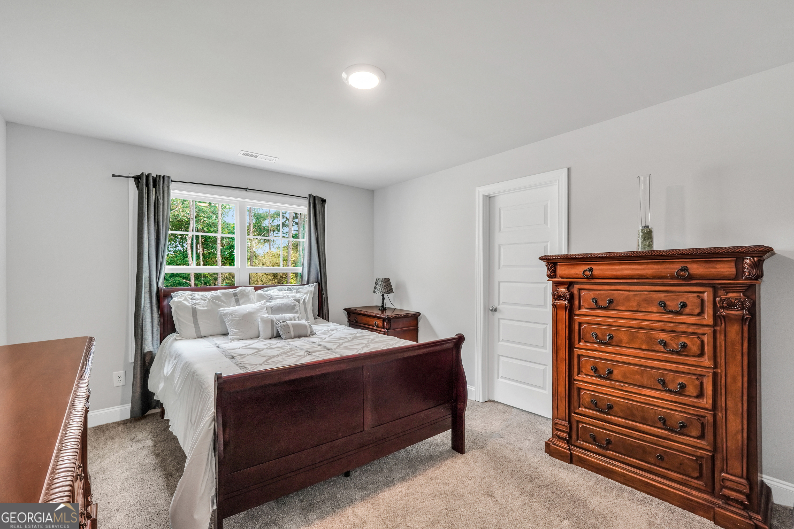 800 Rock House Road Senoia, GA 30276 - Photo 12 of 23 a bedroom with a bed and a window