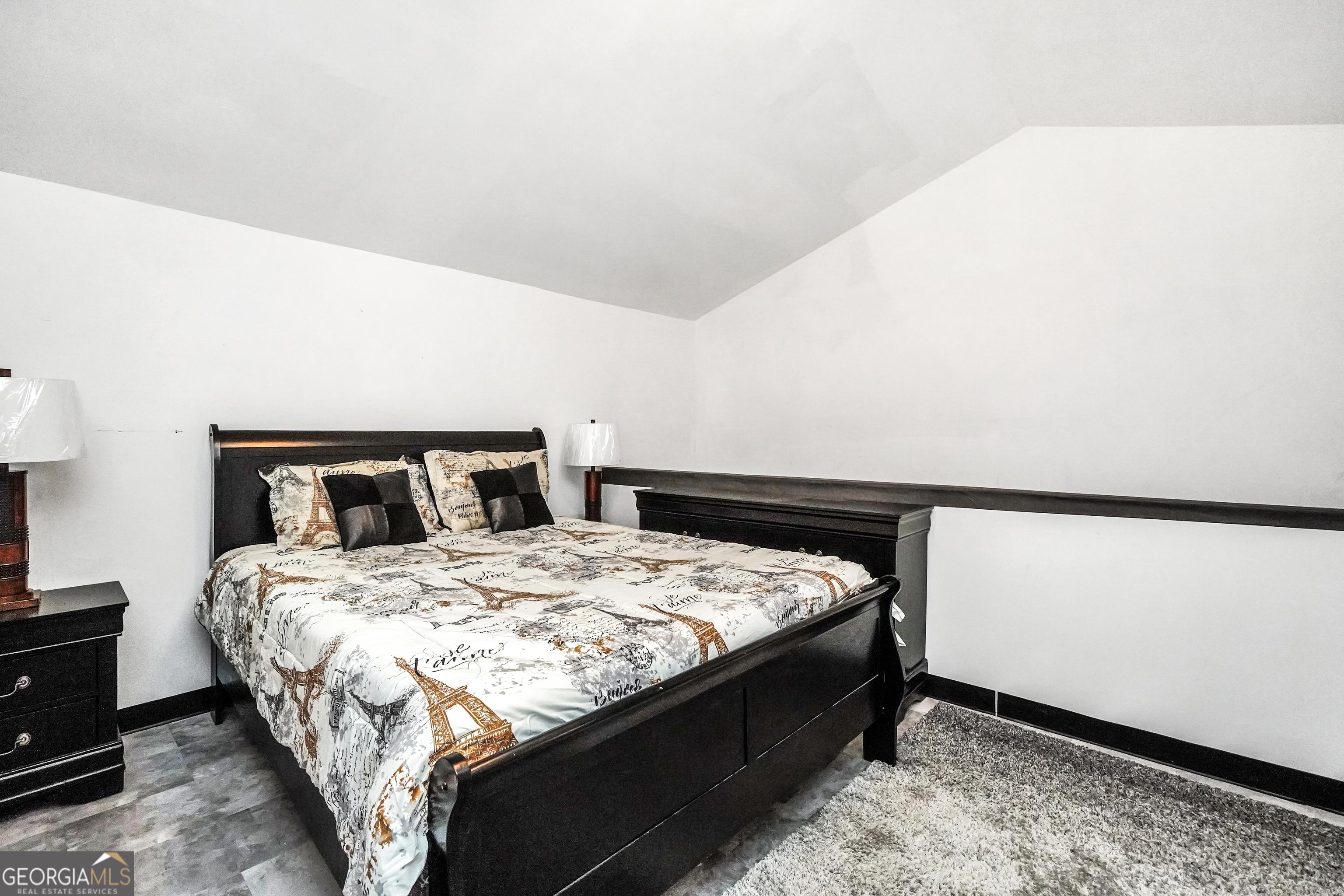 800 Rock House Road Senoia, GA 30276 - Photo 15 of 23 a bed sitting in a bedroom and table