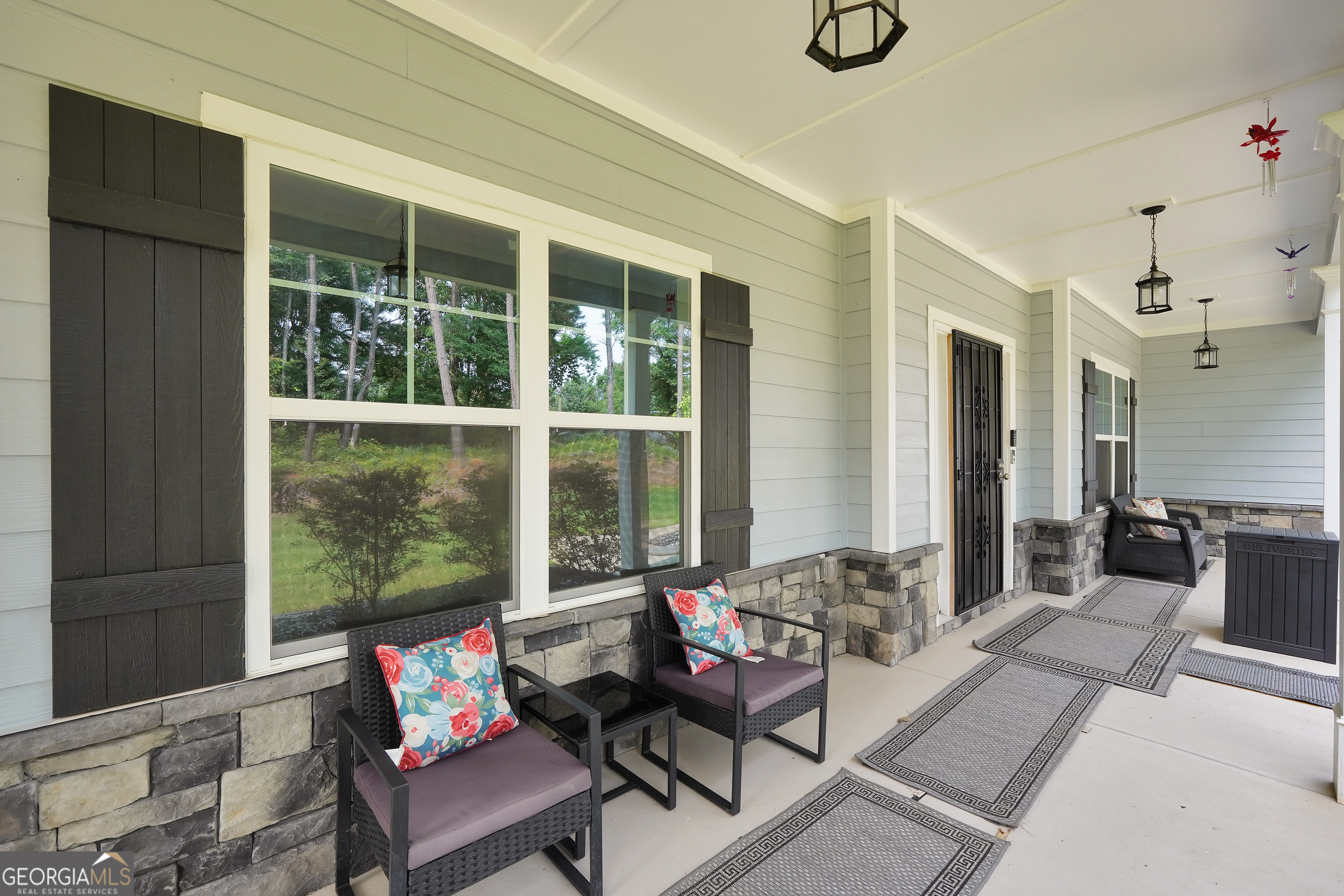 800 Rock House Road Senoia, GA 30276 - Photo 16 of 23 a living room with furniture and a large window