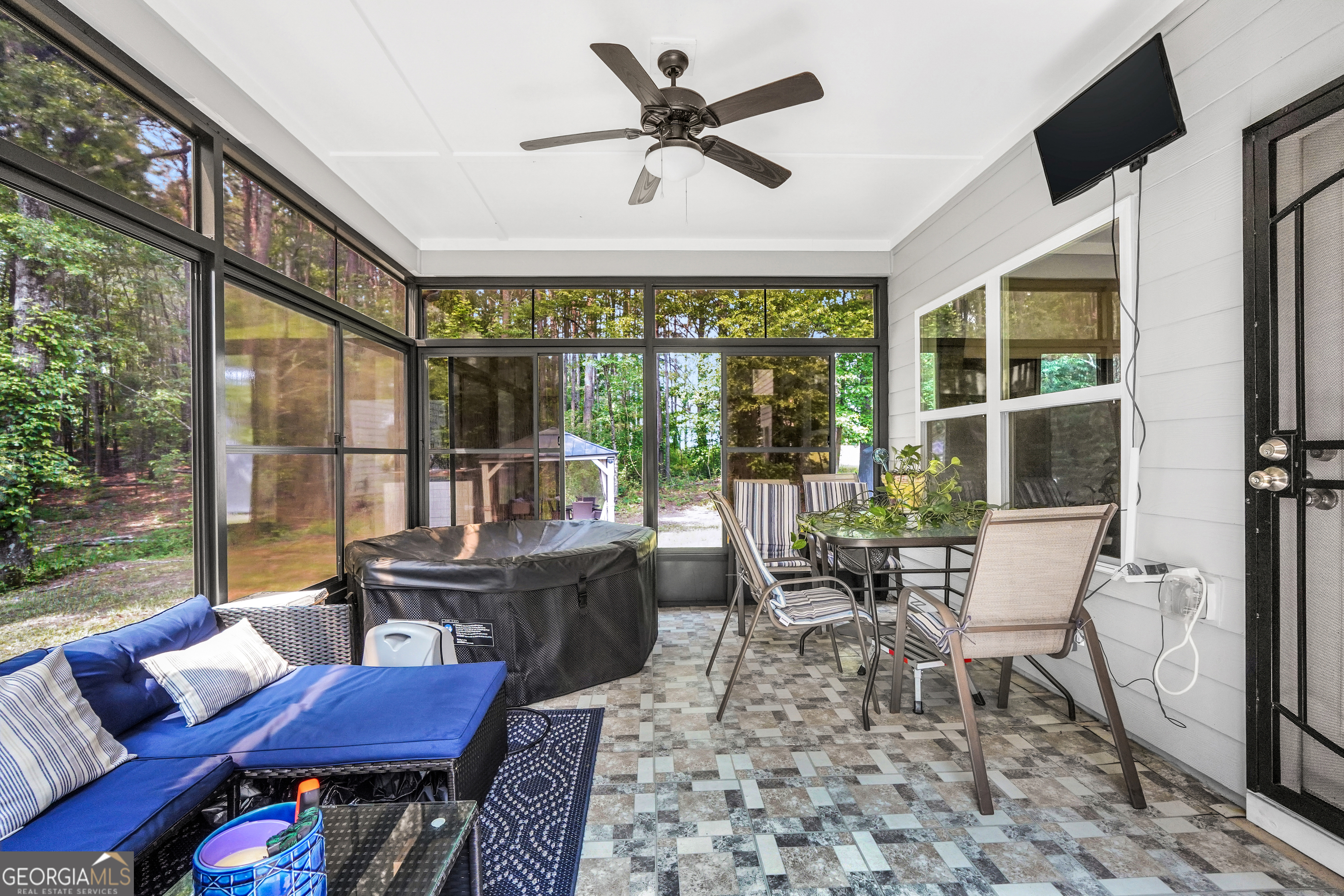 800 Rock House Road Senoia, GA 30276 - Photo 17 of 23 a dining room with furniture a rug and a large window