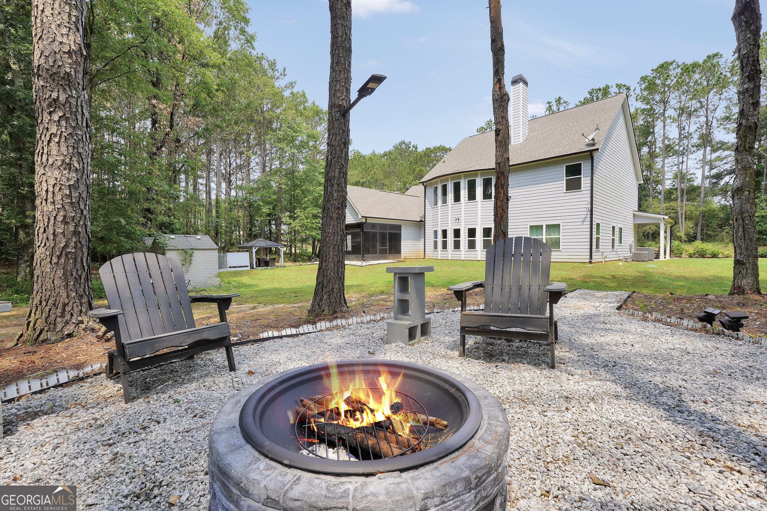 800 Rock House Road Senoia, GA 30276 - Photo 18 of 23 a view of a swimming pool with a lounge chair