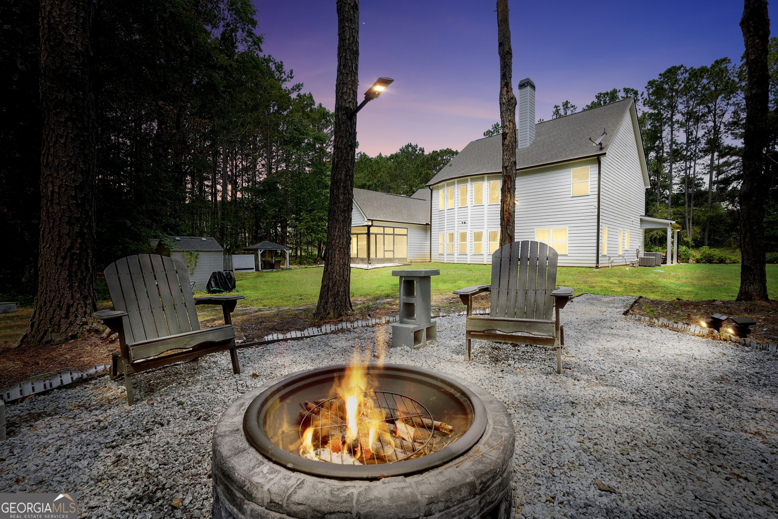 800 Rock House Road Senoia, GA 30276 - Photo 19 of 23 a view of a swimming pool with a sitting space