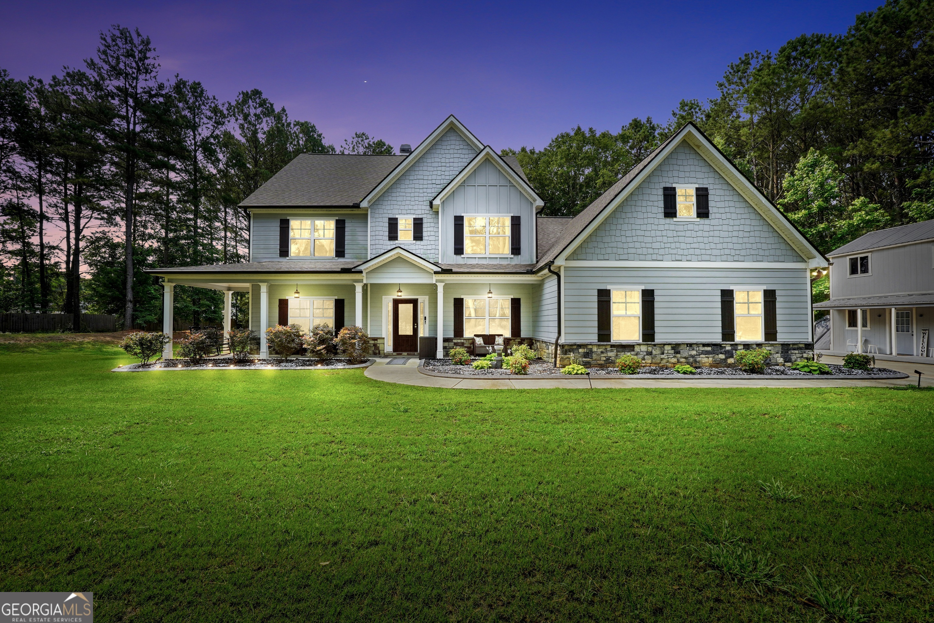 800 Rock House Road Senoia, GA 30276 - Photo 2 of 23 a front view of a house with yard patio and green space