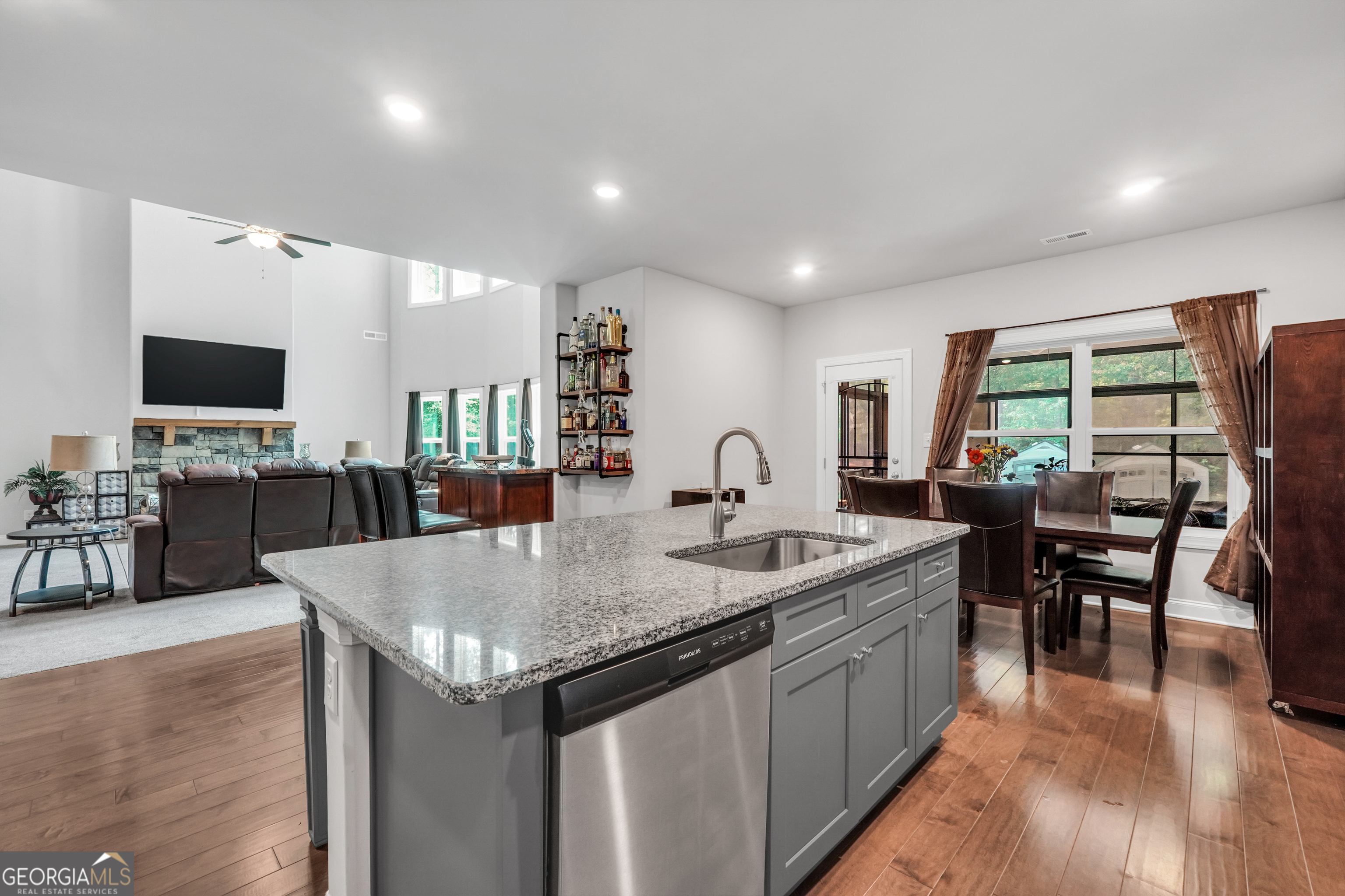 800 Rock House Road Senoia, GA 30276 - Photo 6 of 23 a kitchen with center island table and chairs