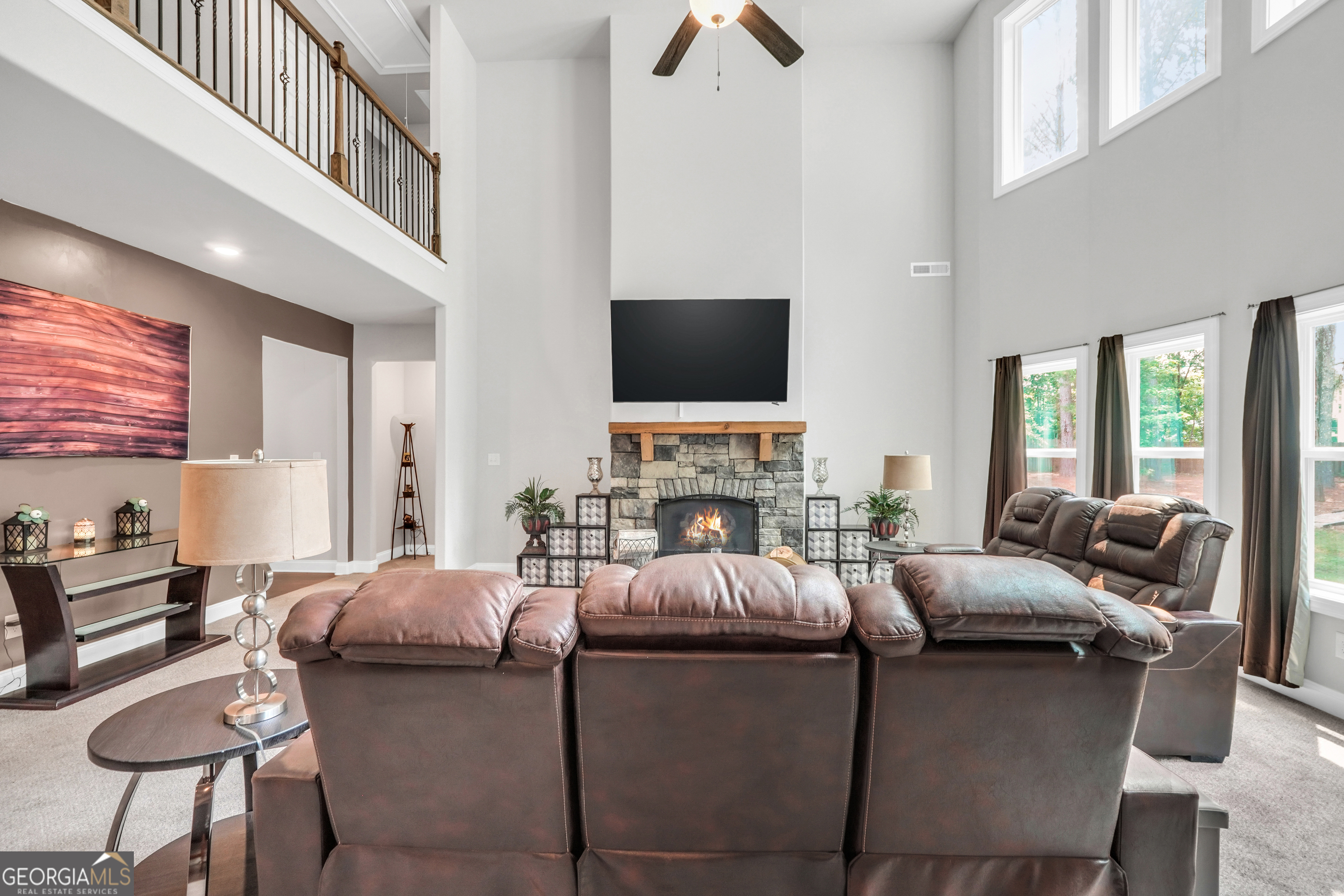 800 Rock House Road Senoia, GA 30276 - Photo 9 of 23 a living room with furniture and a flat screen tv