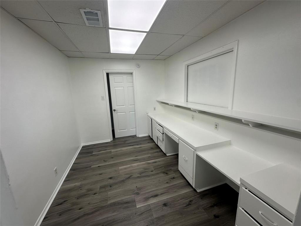 4723 North Loy Lake Road Sherman, TX 75092 - Photo 13 of 16 a room with wooden floor and white walls