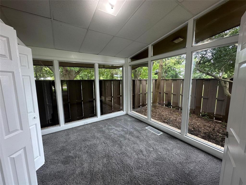 4723 North Loy Lake Road Sherman, TX 75092 - Photo 2 of 16 a view of backyard with large window and front door