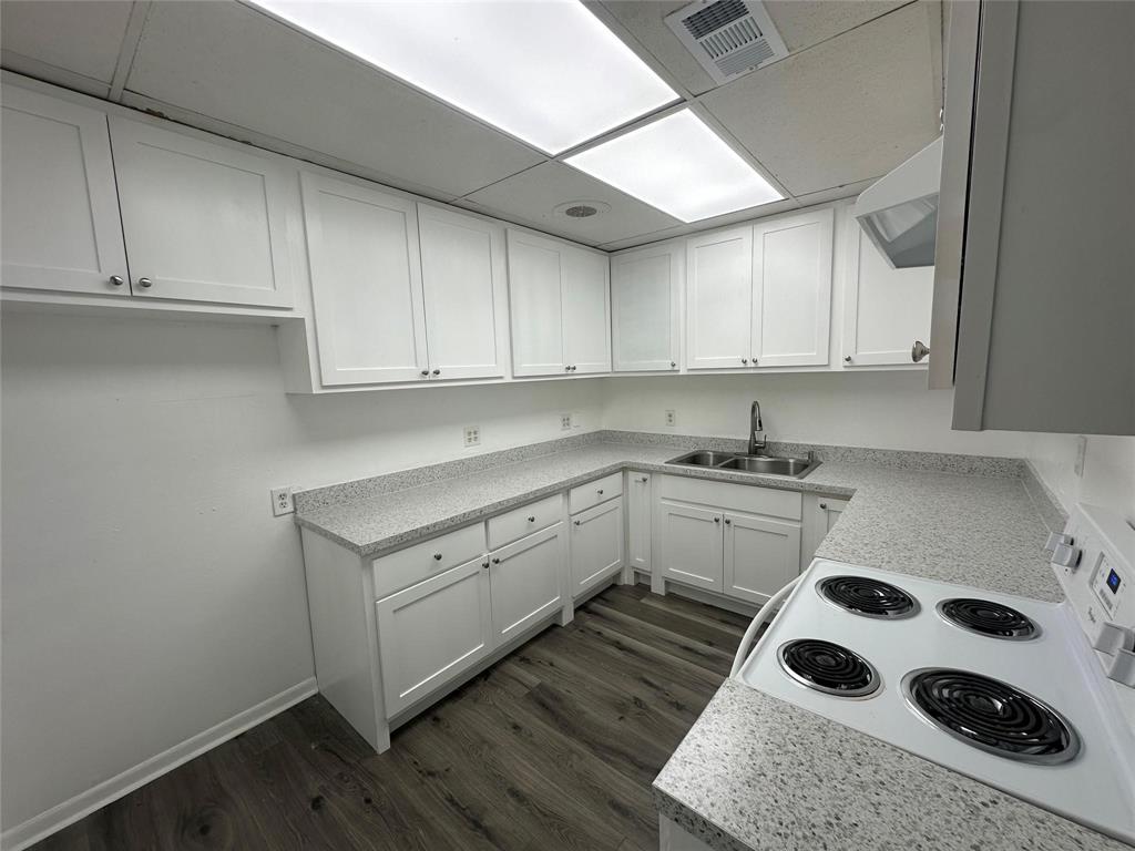 4723 North Loy Lake Road Sherman, TX 75092 - Photo 3 of 16 a kitchen with a cabinets and white appliances