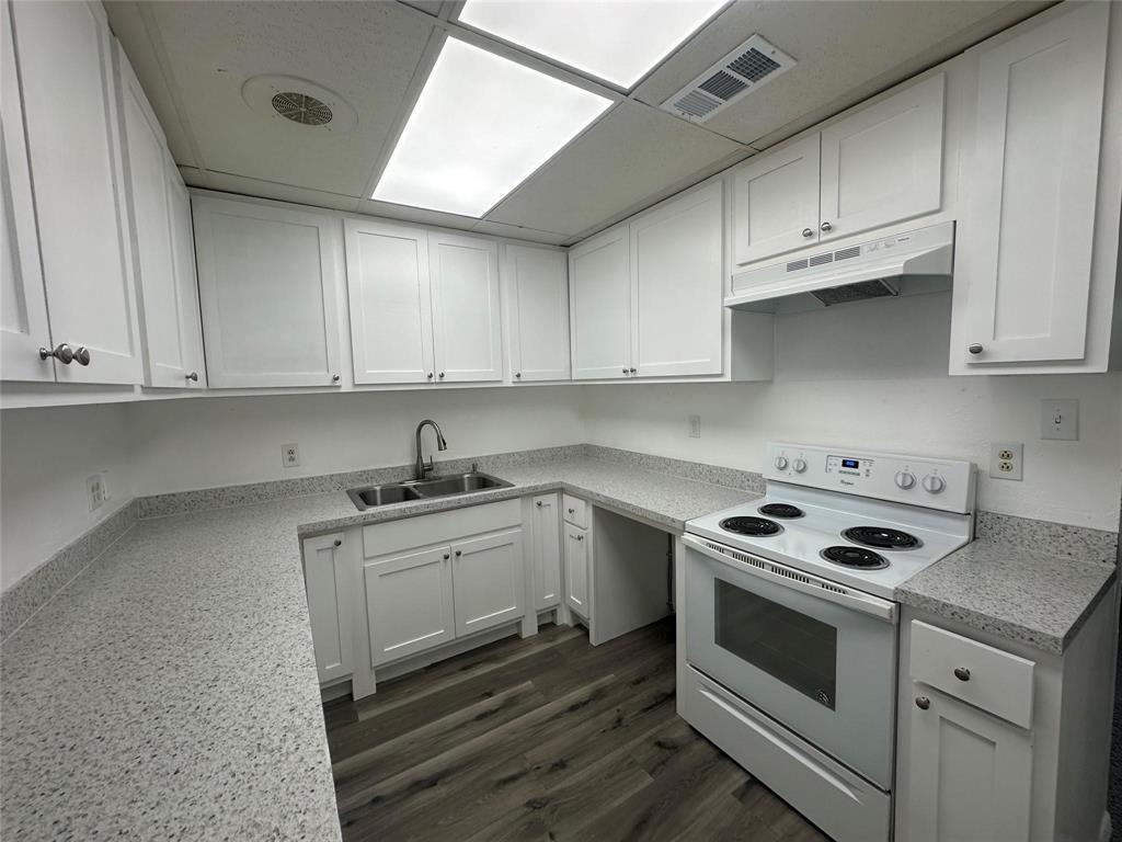 4723 North Loy Lake Road Sherman, TX 75092 - Photo 6 of 16 a kitchen with granite countertop cabinets stainless steel appliances and sink