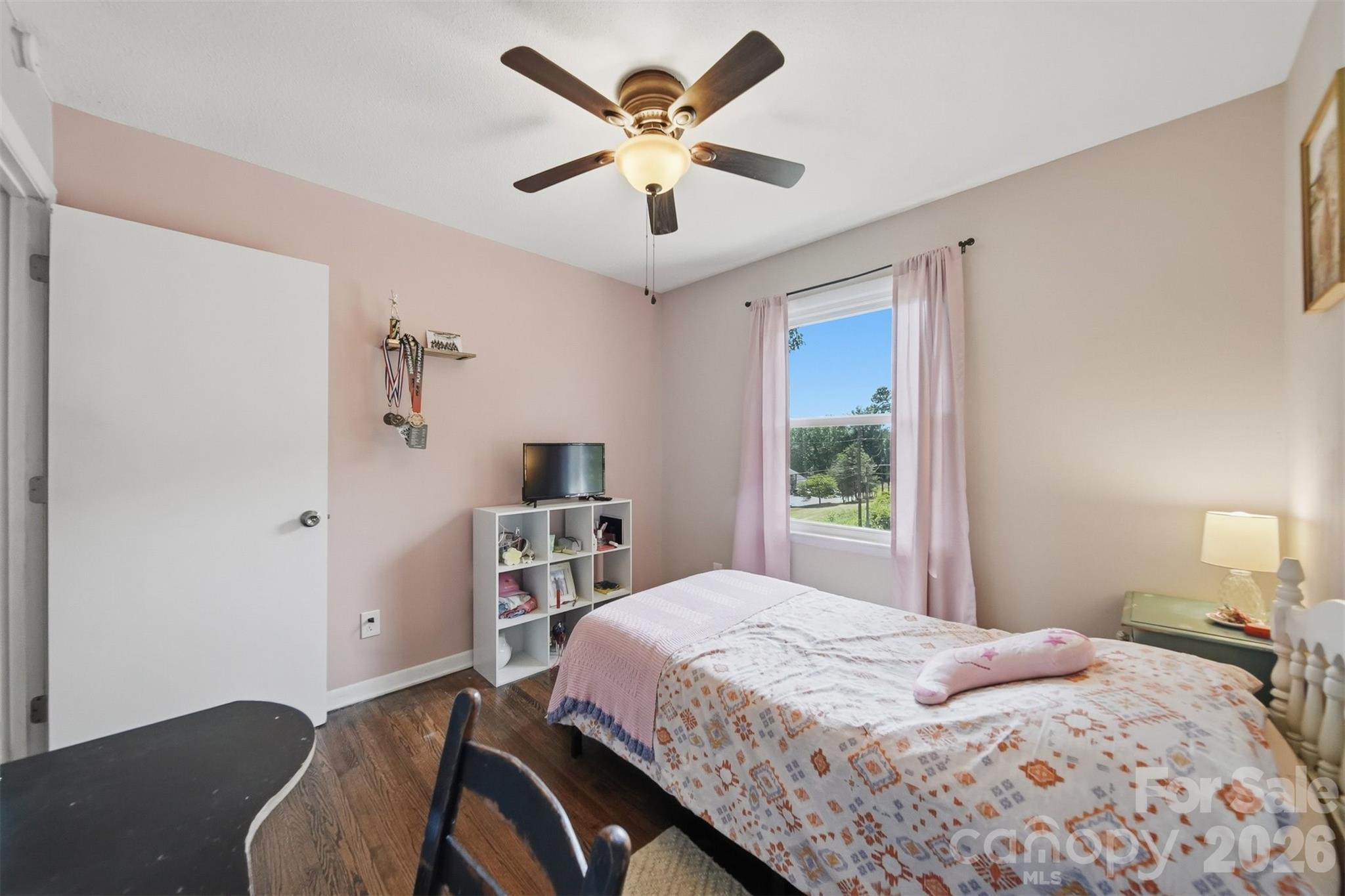1312 County Home Road Conover, NC 28613 - Photo 17 of 25 a bedroom with a bed and a chandelier