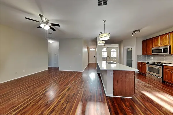 a view of a kitchen from the hallway