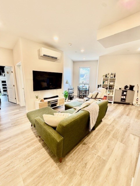 5 Fremont Street, Unit 301 Winthrop, MA 02152 - Photo 3 of 18 a living room with couches and a flat screen tv