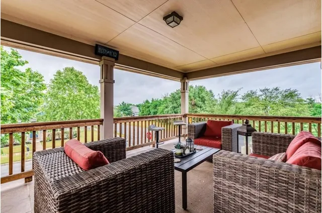 a view of balcony with furniture