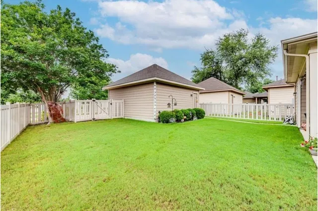 a view of a backyard with a garden