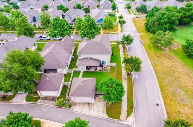 an aerial view of house with yard swimming pool and outdoor seating