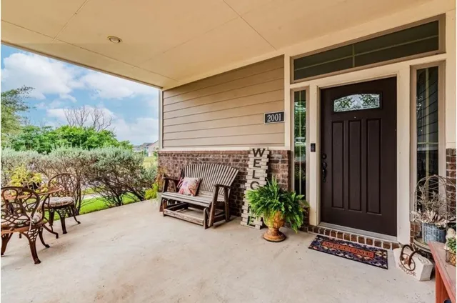 a view of an outdoor space with porch and furniture