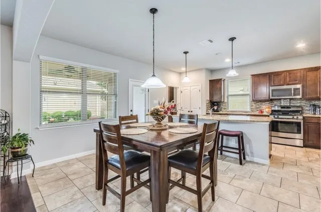 a view of a dining room and furniture window and wooden floor
