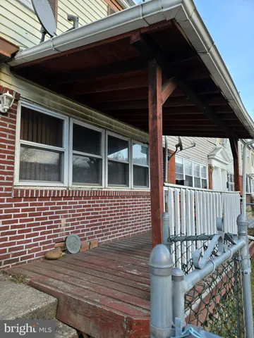 a view of house with wooden deck