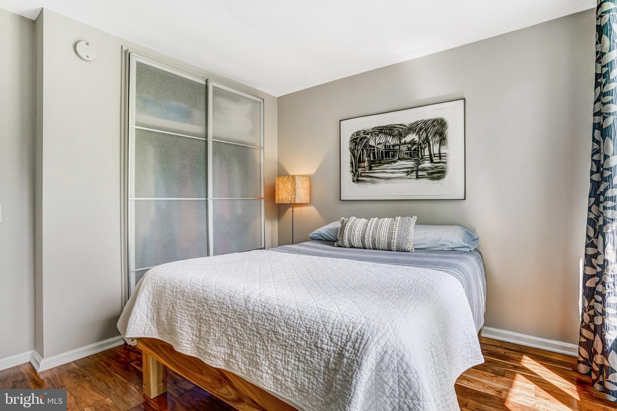 1937 Marthas Road Alexandria, VA 22307 - Photo 41 of 51 a bedroom with a bed and a painting on the wall