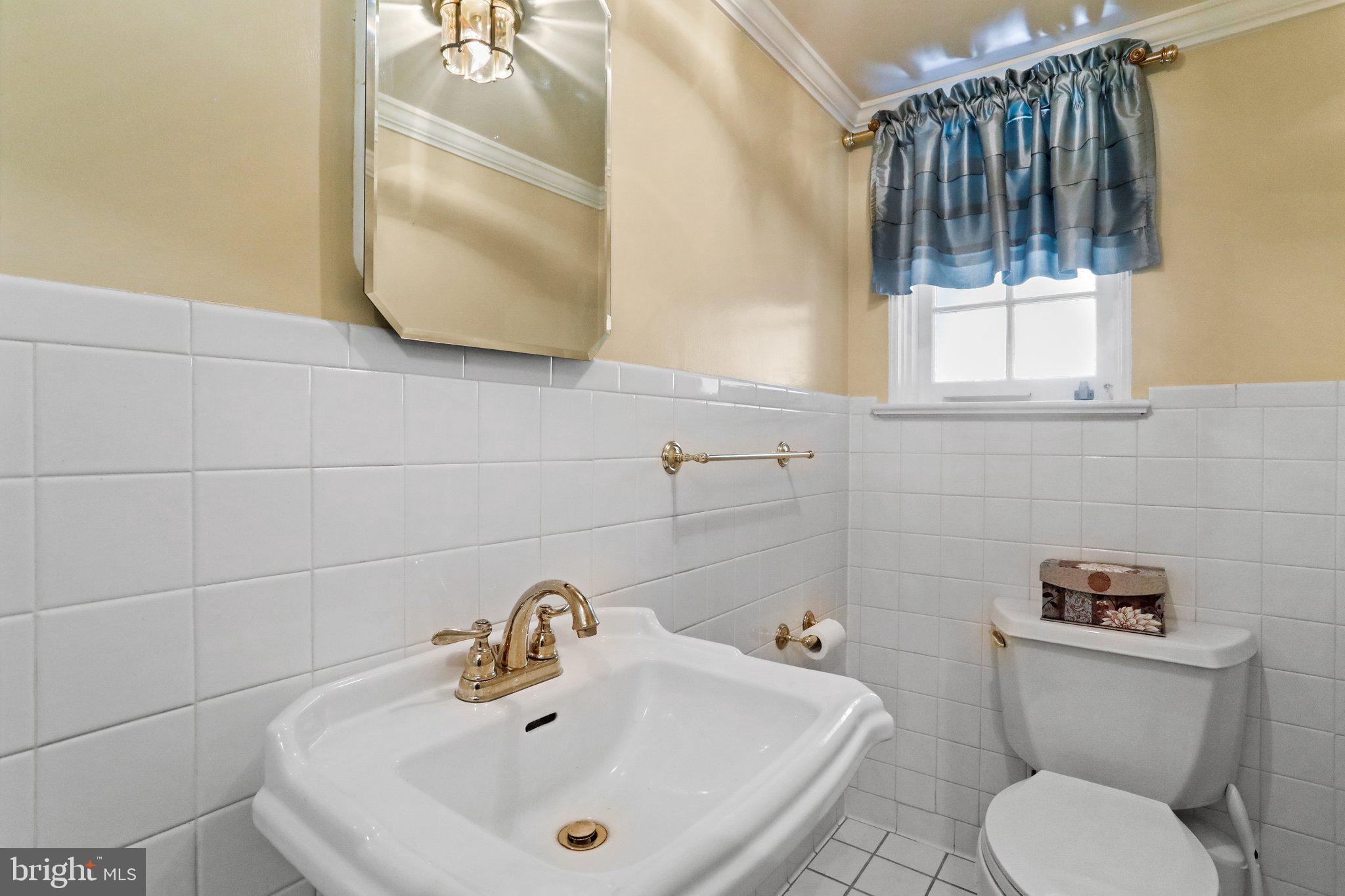 815 Windsor Road Cumberland, MD 21502 - Photo 19 of 46 Half bathroom just off of the kitchen!