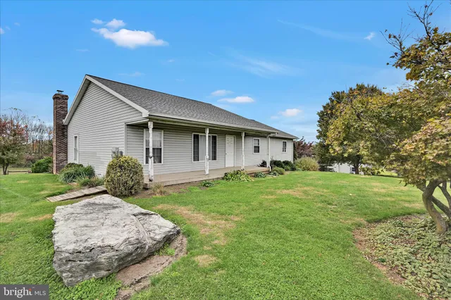 a view of a livingroom with furniture and a chandelier