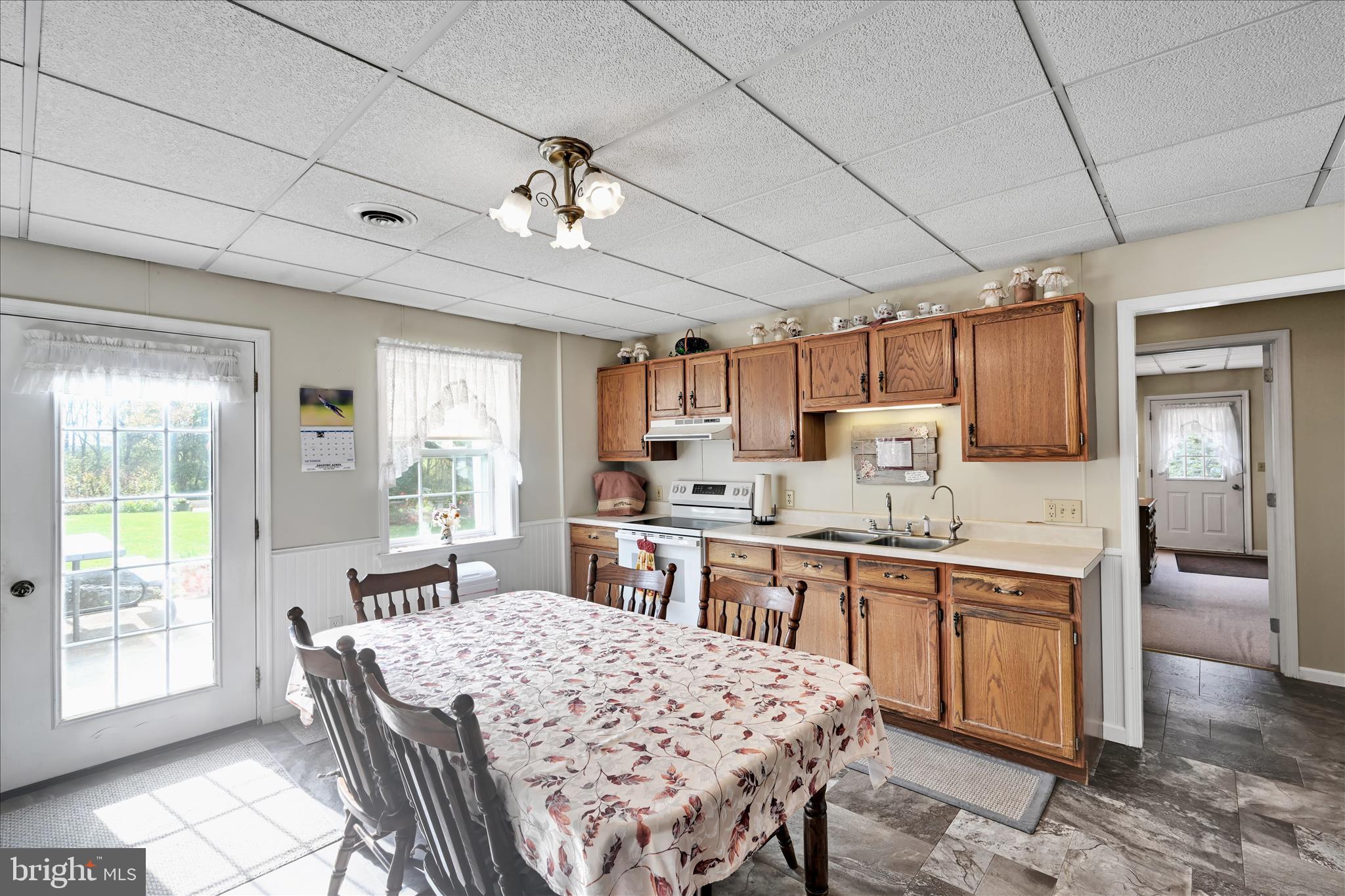 188 Lengle Road Myerstown, PA 17067 - Photo 20 of 58 a large kitchen with kitchen island a sink table and chairs