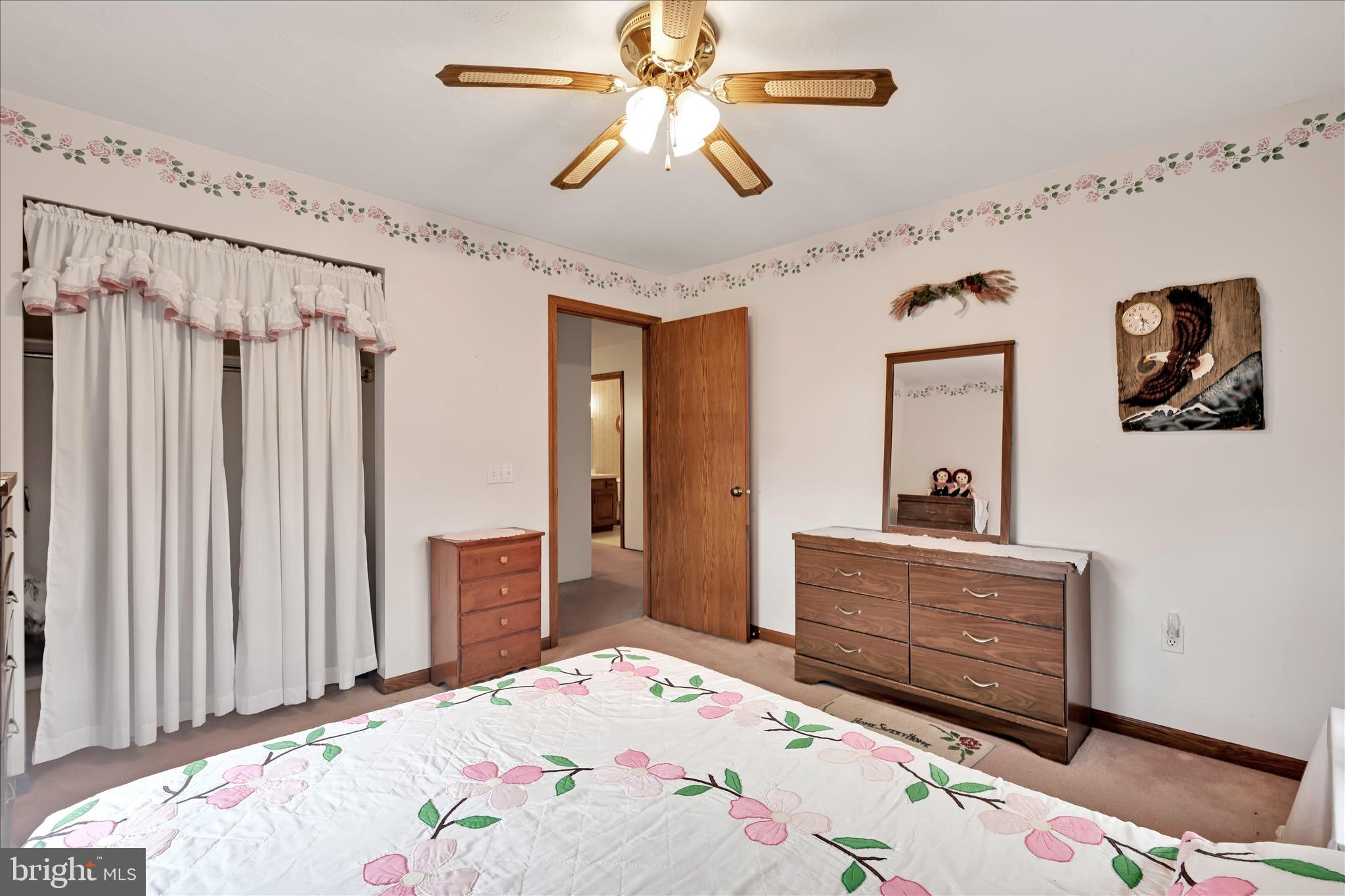 188 Lengle Road Myerstown, PA 17067 - Photo 23 of 58 a bedroom with a bed and a chandelier
