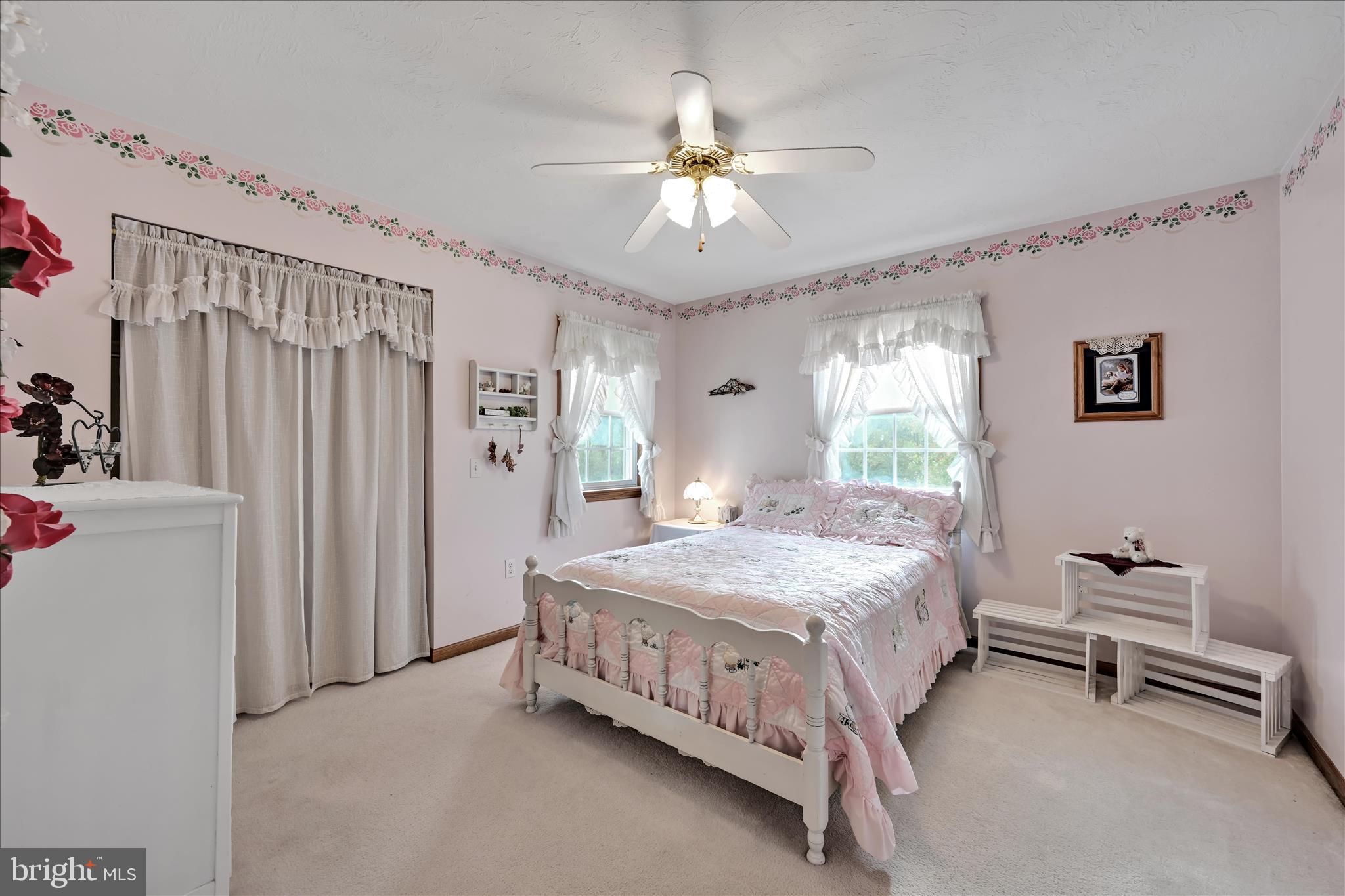 188 Lengle Road Myerstown, PA 17067 - Photo 24 of 58 a bedroom with a bed and a chandelier