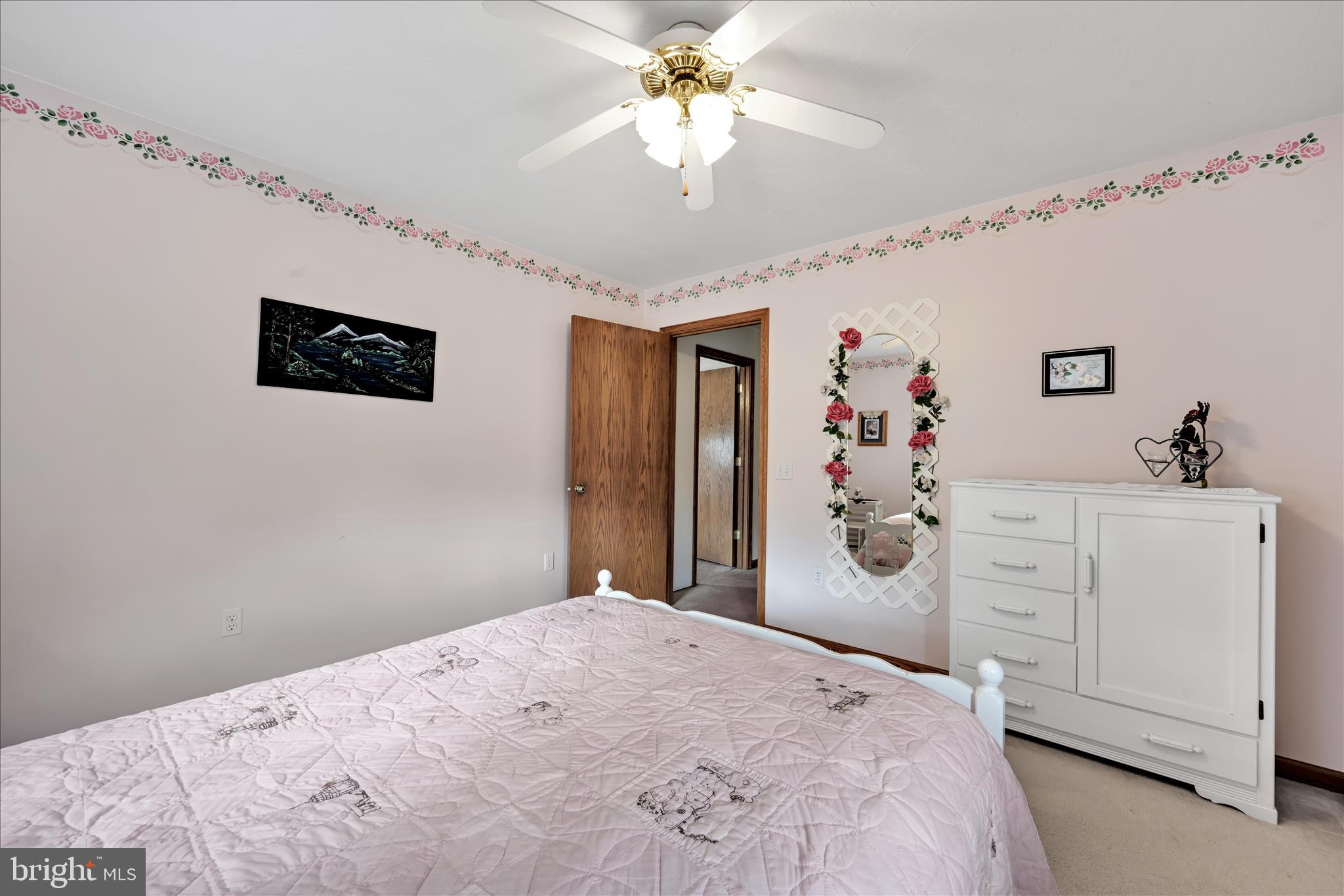 188 Lengle Road Myerstown, PA 17067 - Photo 25 of 58 a bedroom with a bed and a chandelier