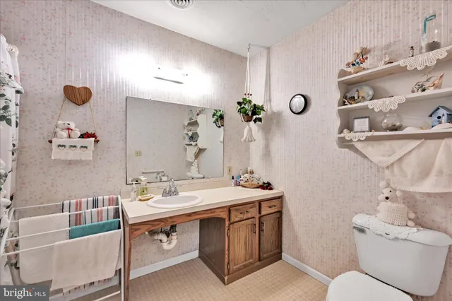 a bed room with a bed and a television