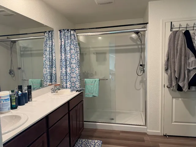 a bedroom with a bed and cabinets