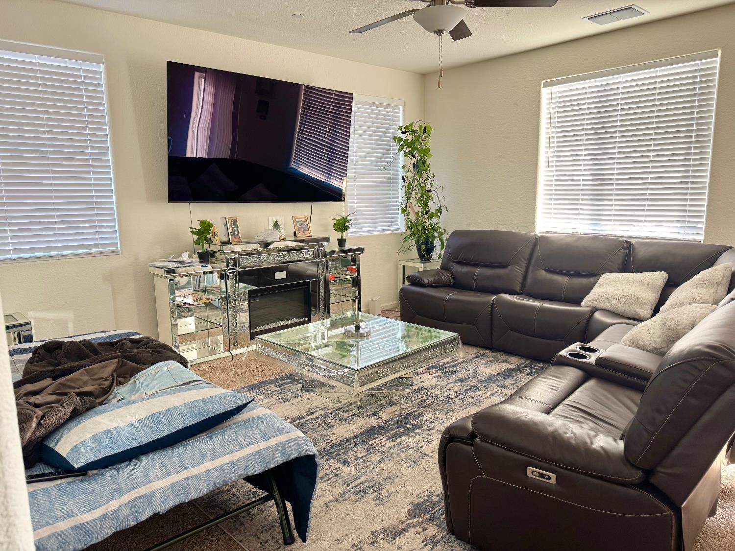 3414 Seger Way Stockton, CA 95212 - Photo 4 of 16 a living room with furniture a flat screen tv and a window