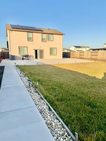 a house view with garden space