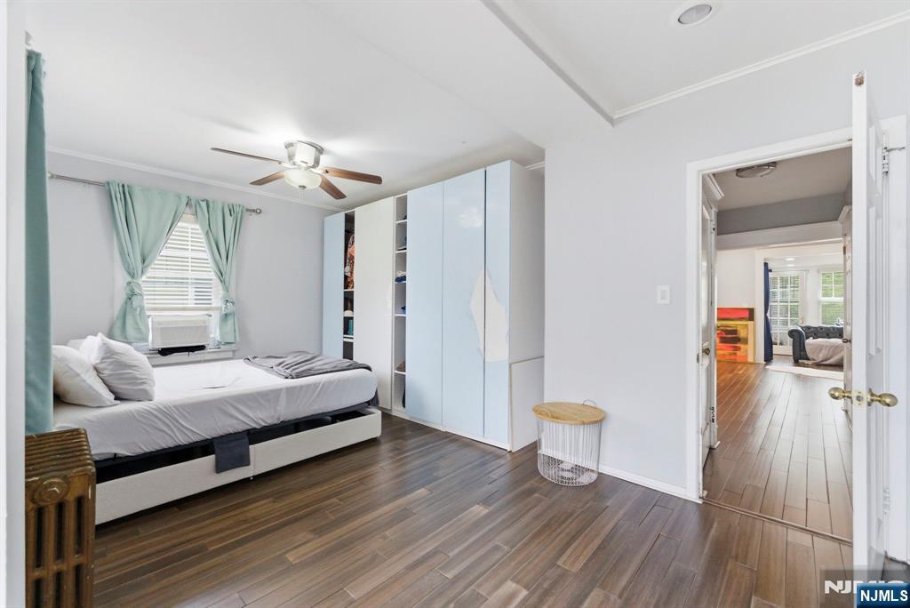 105 Daniel Avenue Rutherford, NJ 07070 - Photo 21 of 38 a bedroom with a bed and a chandelier