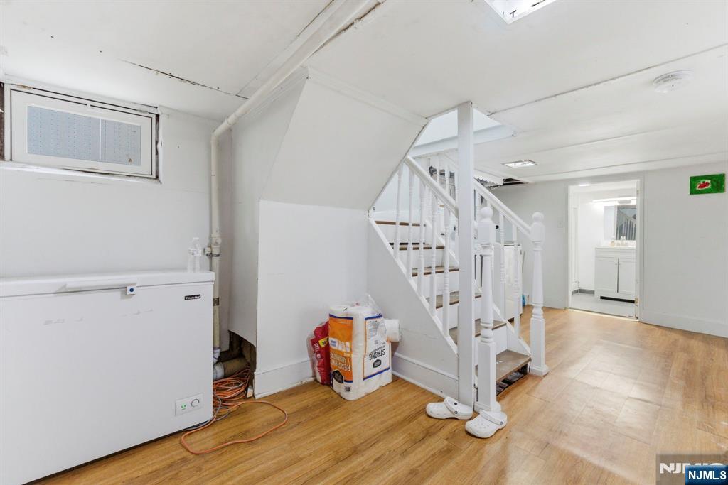105 Daniel Avenue Rutherford, NJ 07070 - Photo 25 of 38 a view of entryway with stairs and wooden floor