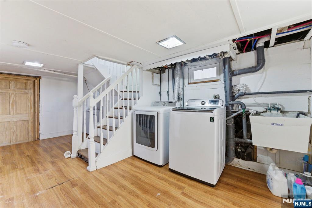 105 Daniel Avenue Rutherford, NJ 07070 - Photo 26 of 38 a view of a storage & utility room with two washing machine