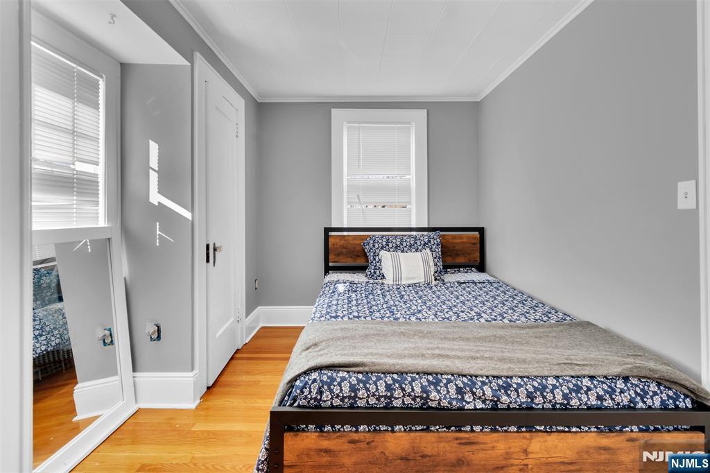 105 Daniel Avenue Rutherford, NJ 07070 - Photo 29 of 38 a bedroom with a bed and wooden floor
