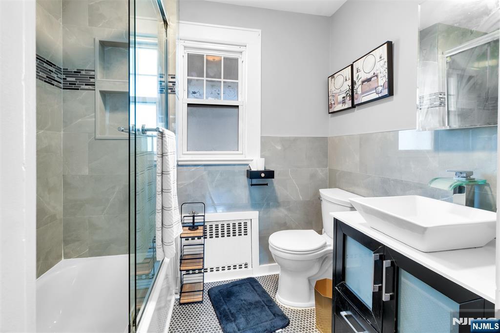 105 Daniel Avenue Rutherford, NJ 07070 - Photo 34 of 38 a bathroom with a sink toilet and a shower