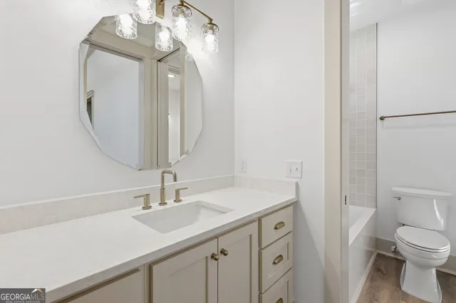 an aerial view of a house with swimming pool garden and patio