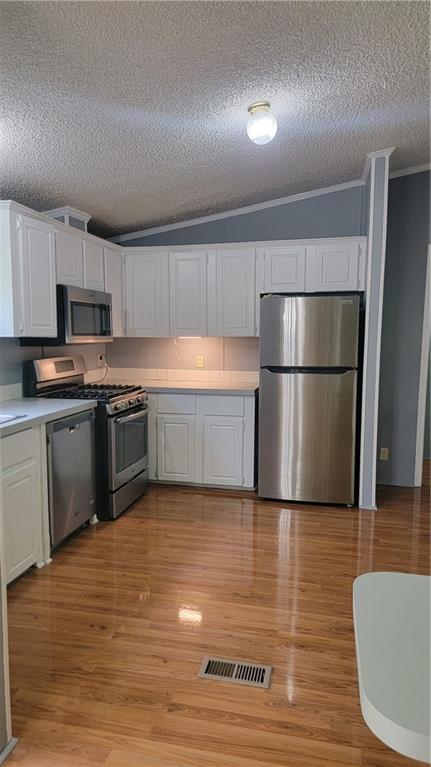 174 Luther Circle Villa Rica, GA 30180 - Photo 5 of 32 a kitchen with stainless steel appliances granite countertop a refrigerator a stove a sink and a microwave