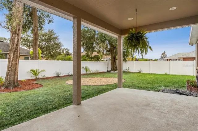 a view of a porch in front of a house with a yard