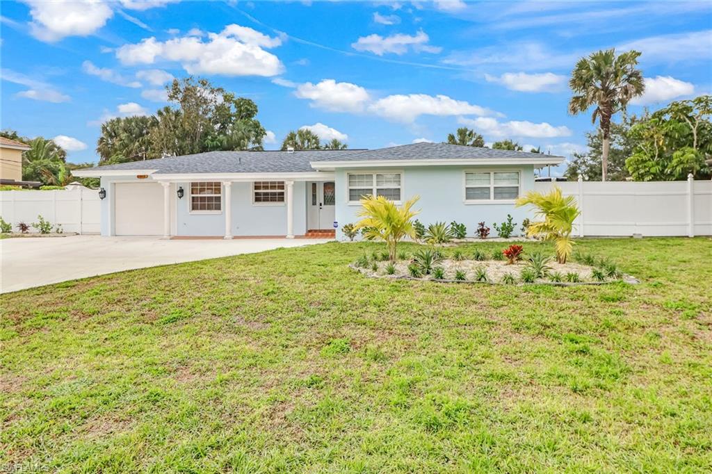 a front view of a house with a garden and porch
