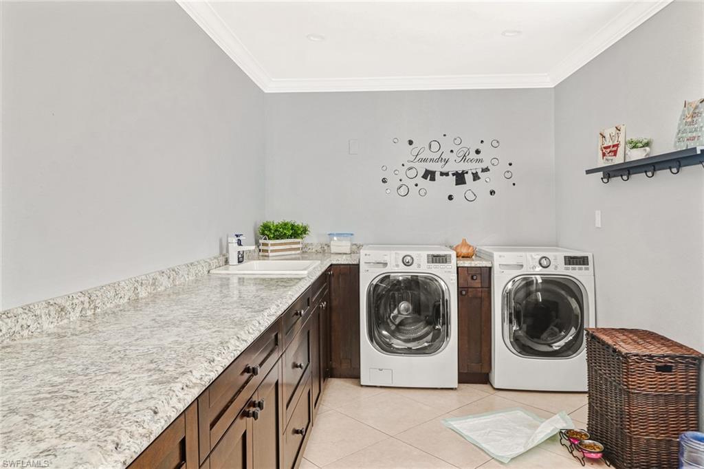 2329 41st Terrace Southwest Naples, FL 34116 - Photo 23 of 33 a utility room with dryer and washer