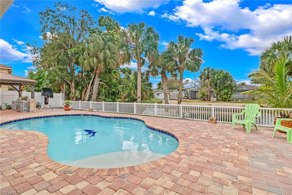 2329 41st Terrace Southwest Naples, FL 34116 - Photo 26 of 33 a view of a swimming pool with a patio