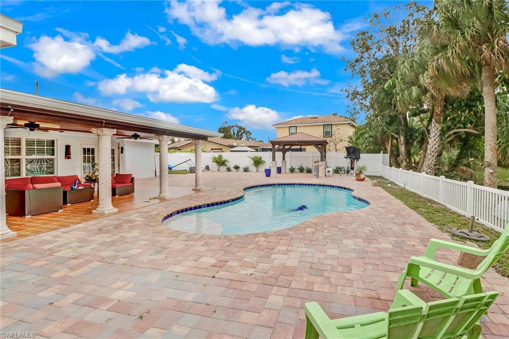 2329 41st Terrace Southwest Naples, FL 34116 - Photo 27 of 33 a view of a swimming pool with a patio
